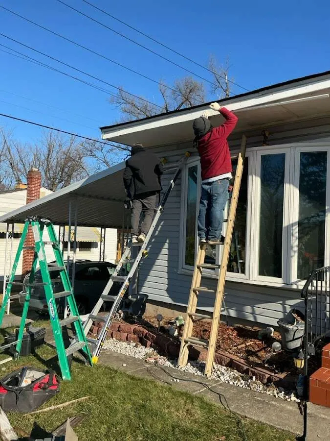 Restoration crew performing exterior repair in Hughson